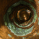 Biofilm contamination to the inside surfaces of a copper pipe