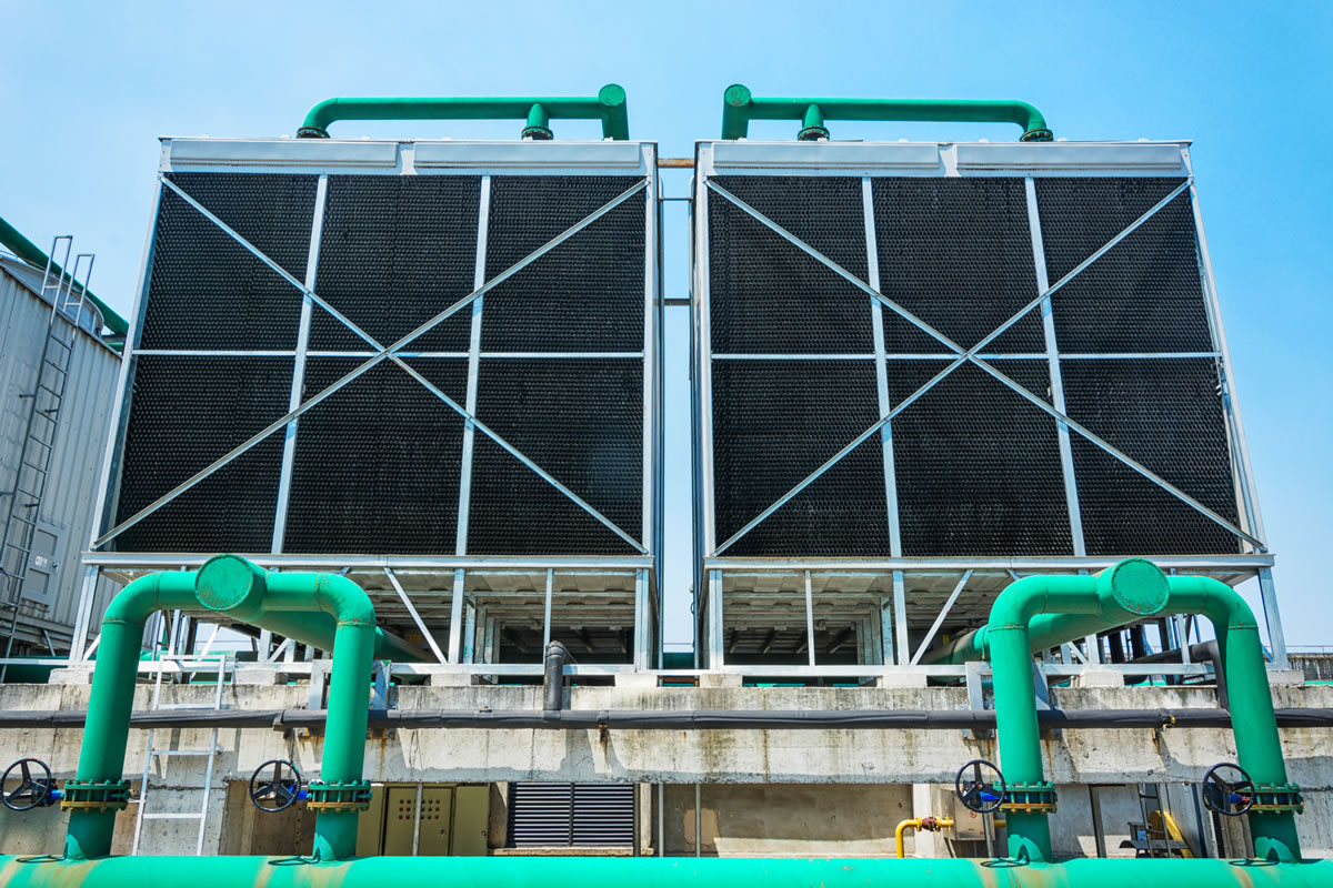 Roof top cooling tower treated with biocides and biodispersants