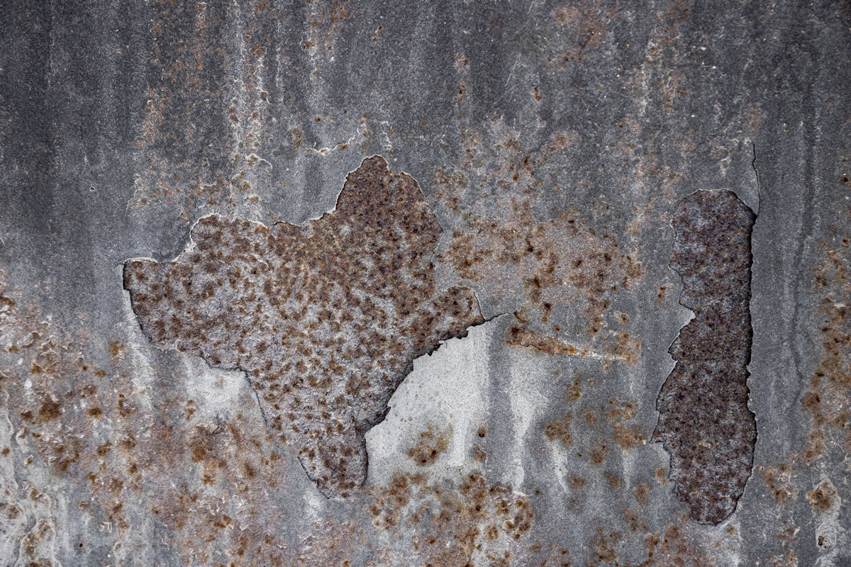 Steel surfaces badly affected by extensive pitting corrosion Steel surfaces badly affected by extensive pitting corrosion