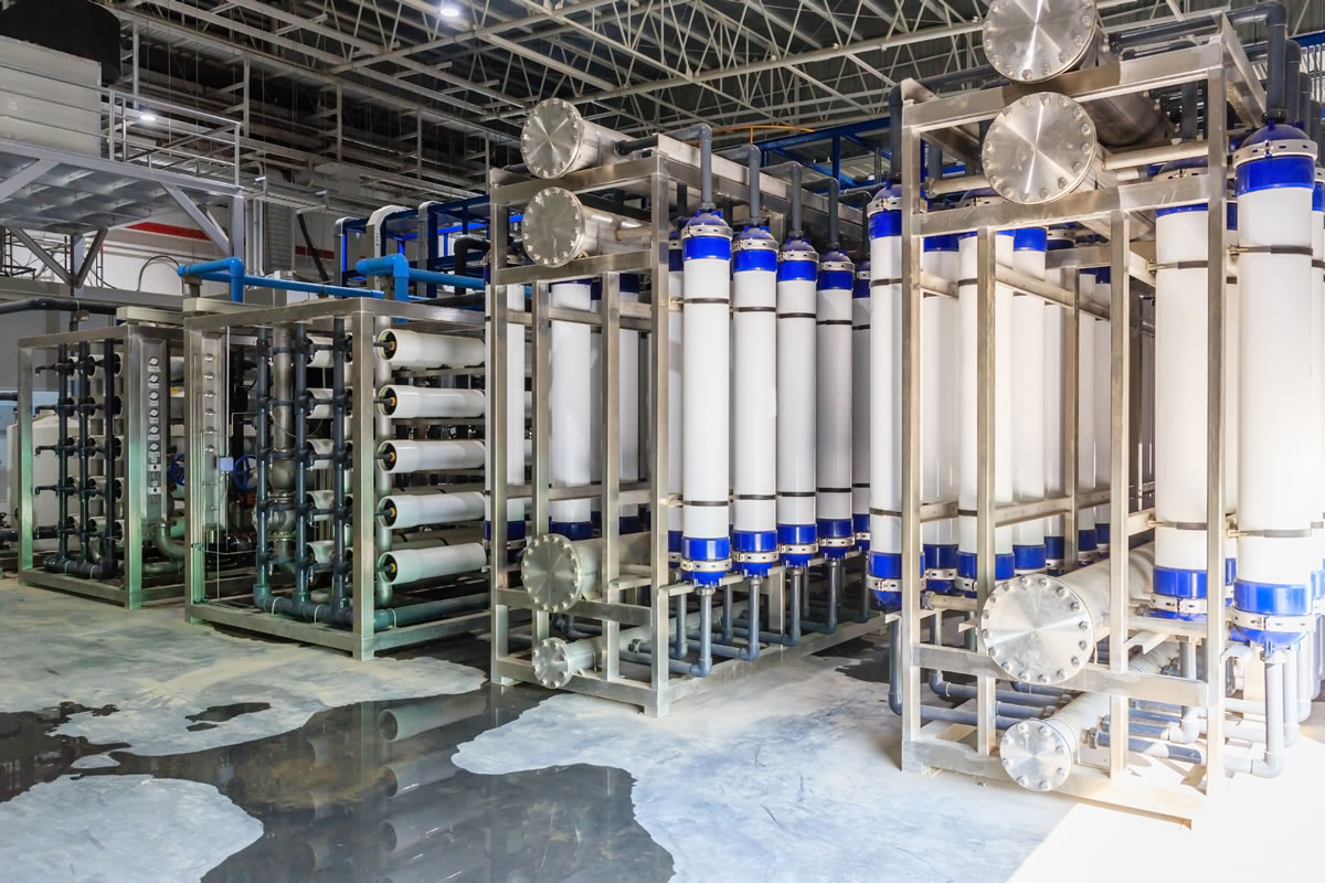Commercial reverse osmosis installation with white filtration columns