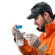 Engineer taking water sample for quality analysis